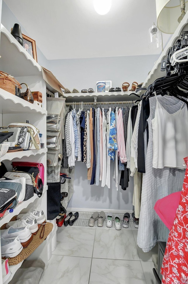 438 Pine Villa Dr, Atlantis, FL 33462 - spacious closet featuring marble look tile flooring