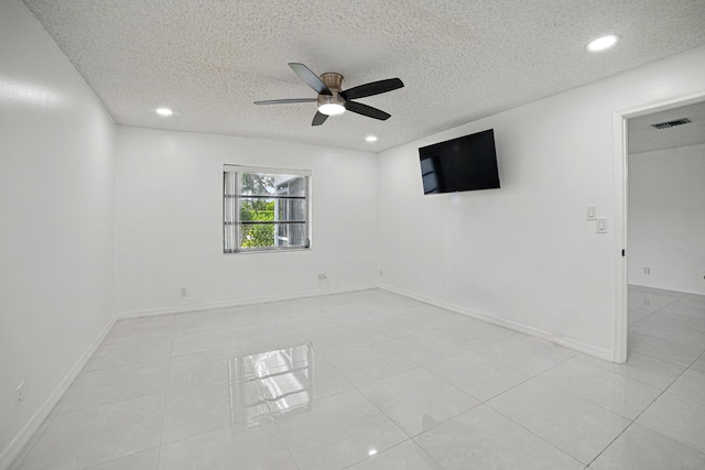5242 Privet Pl Unit C, Delray Beach, FL 33484 - unfurnished room with ceiling fan, a textured ceiling, recessed lighting, light tile patterned flooring, and baseboards
