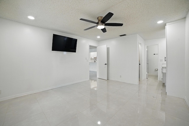 5242 Privet Pl Unit C, Delray Beach, FL 33484 - unfurnished bedroom featuring recessed lighting, a textured ceiling, baseboards, ceiling fan, and light tile patterned floors