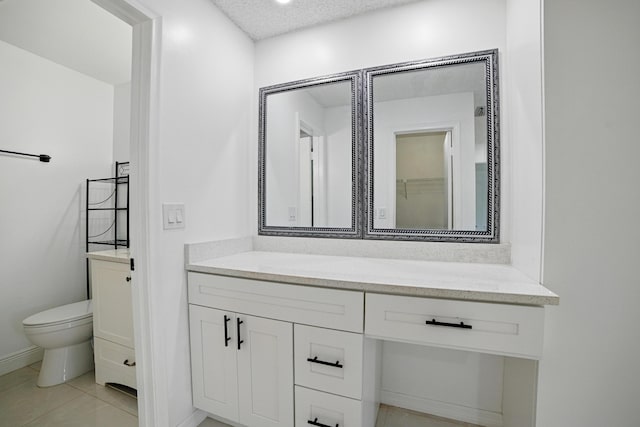 5242 Privet Pl Unit C, Delray Beach, FL 33484 - bathroom featuring vanity, toilet, baseboards, and a textured ceiling