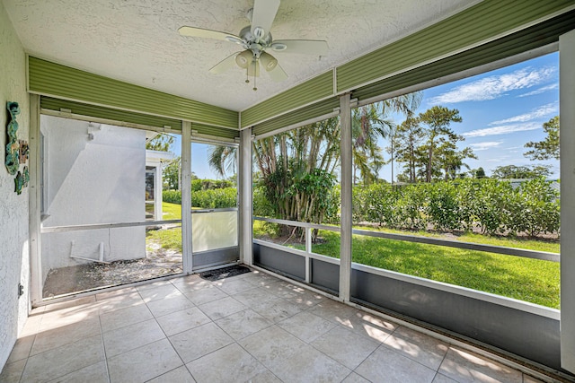 5242 Privet Pl Unit C, Delray Beach, FL 33484 - unfurnished sunroom with a ceiling fan