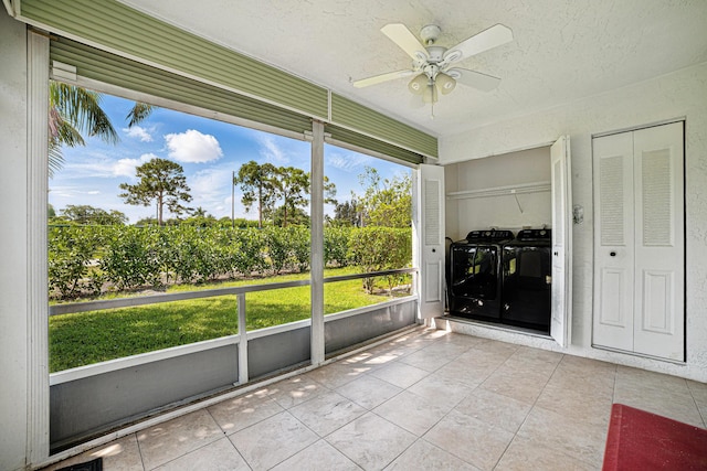 5242 Privet Pl Unit C, Delray Beach, FL 33484 - unfurnished sunroom featuring independent washer and dryer, a ceiling fan, and plenty of natural light