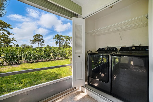 5242 Privet Pl Unit C, Delray Beach, FL 33484 - laundry area with independent washer and dryer, tile patterned flooring, and healthy amount of natural light