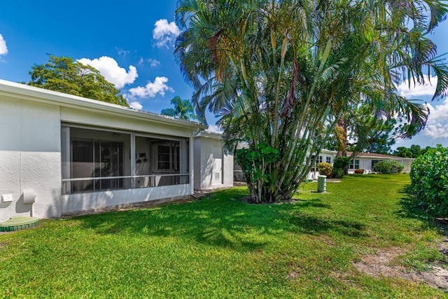5242 Privet Pl Unit C, Delray Beach, FL 33484 - view of green lawn featuring a sunroom