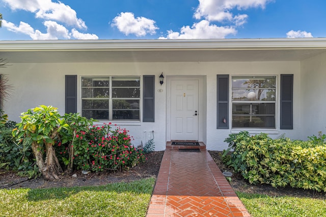 5242 Privet Pl Unit C, Delray Beach, FL 33484 - view of exterior entry with stucco siding