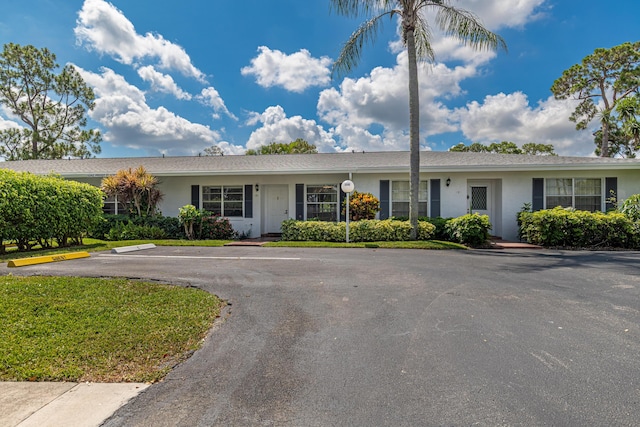 5242 Privet Pl Unit C, Delray Beach, FL 33484 - ranch-style house with uncovered parking and stucco siding