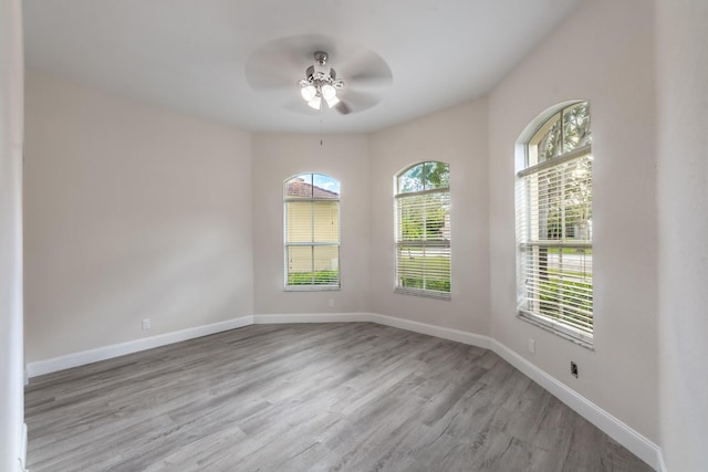 5761 Spanish River Rd, Fort Pierce, FL 34951 - spare room featuring wood finished floors, ceiling fan, and baseboards