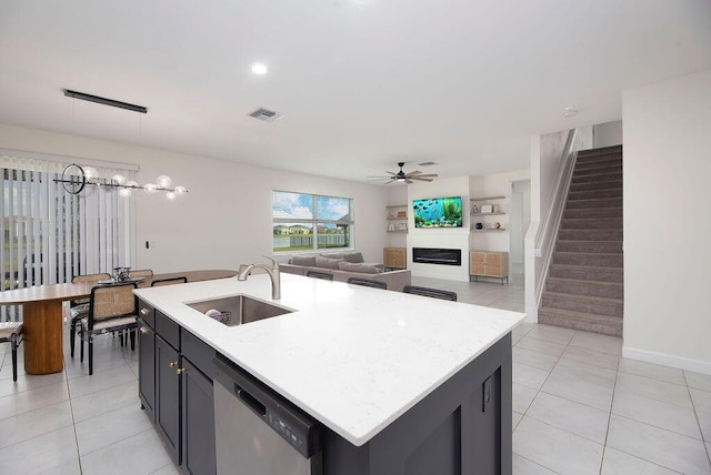 7499 NW Deysbrook Ln, Port Saint Lucie, FL 34987 - kitchen featuring a sink, dishwasher, light tile patterned floors, and ceiling fan