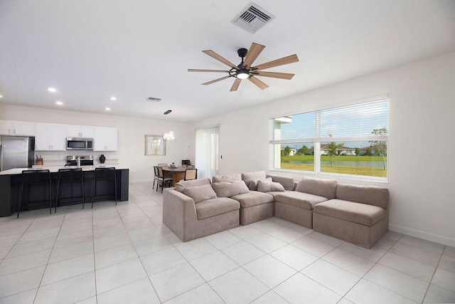 7499 NW Deysbrook Ln, Port Saint Lucie, FL 34987 - living area featuring a ceiling fan, light tile patterned floors, recessed lighting, and baseboards