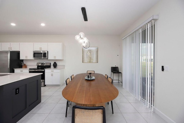 7499 NW Deysbrook Ln, Port Saint Lucie, FL 34987 - dining area featuring light tile patterned flooring, recessed lighting, and baseboards