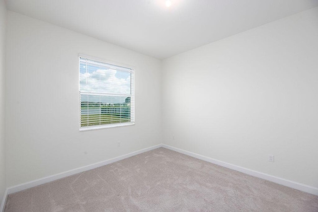 7499 NW Deysbrook Ln, Port Saint Lucie, FL 34987 - carpeted empty room with baseboards