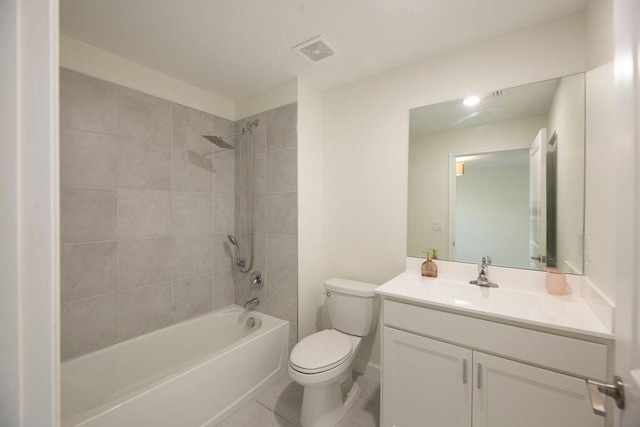 7499 NW Deysbrook Ln, Port Saint Lucie, FL 34987 - bathroom featuring toilet, vanity, washtub / shower combination, and tile patterned floors