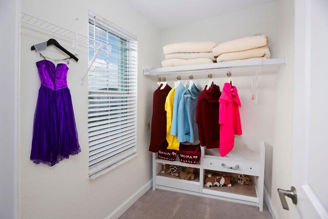 7499 NW Deysbrook Ln, Port Saint Lucie, FL 34987 - mudroom with baseboards and carpet