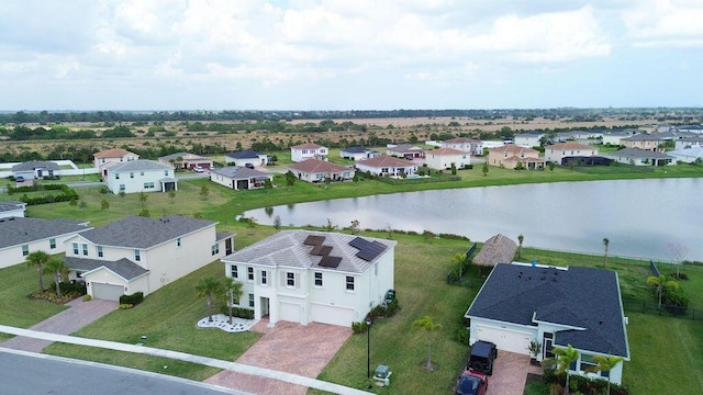 7499 NW Deysbrook Ln, Port Saint Lucie, FL 34987 - aerial perspective of suburban area with a nearby body of water