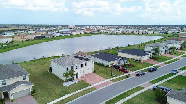7499 NW Deysbrook Ln, Port Saint Lucie, FL 34987 - aerial perspective of suburban area featuring a nearby body of water