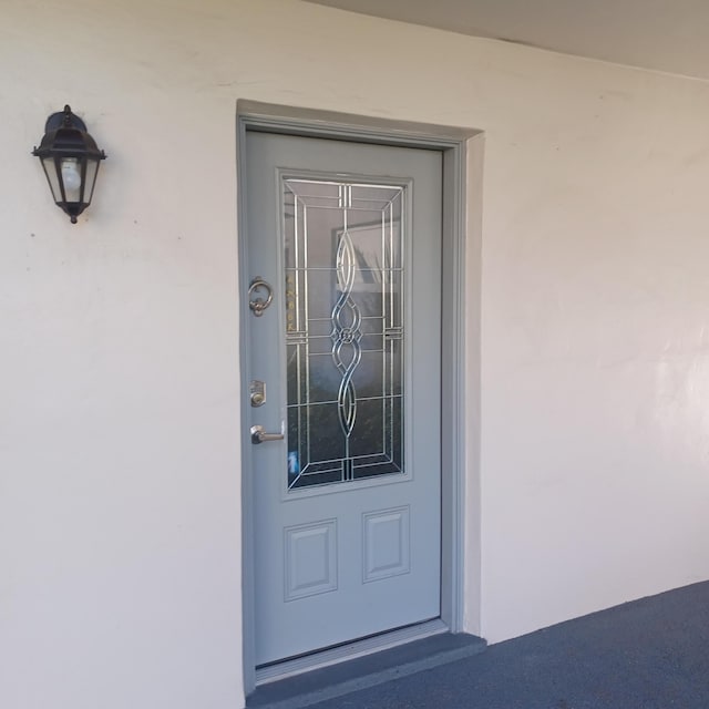 54 Piedmont Unit B, Delray Beach, FL 33484 - view of exterior entry with stucco siding