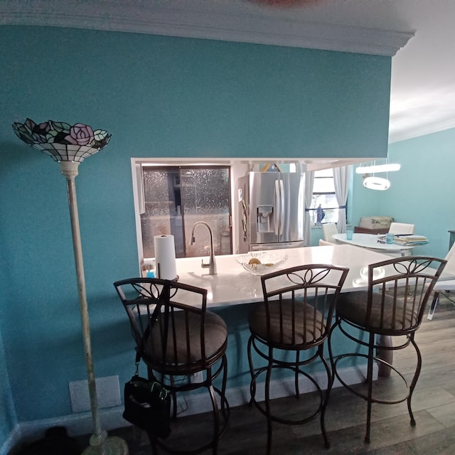 54 Piedmont Unit B, Delray Beach, FL 33484 - dining area featuring crown molding and wood finished floors