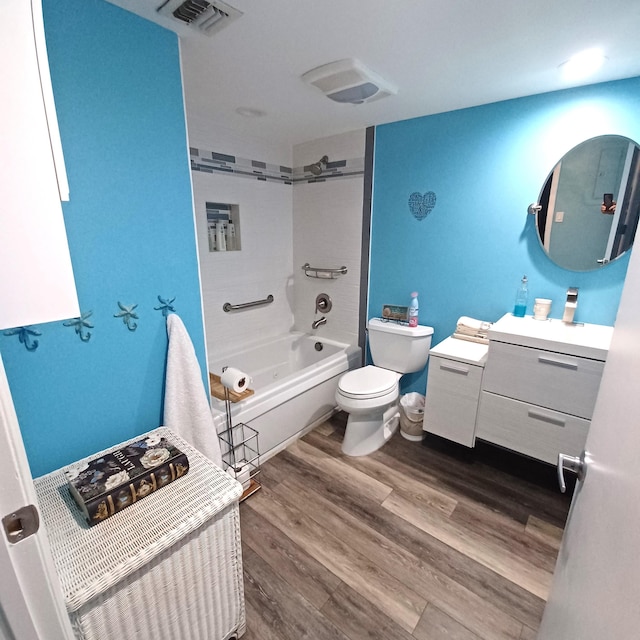 54 Piedmont Unit B, Delray Beach, FL 33484 - bathroom with toilet, tub / shower combination, vanity, and wood finished floors