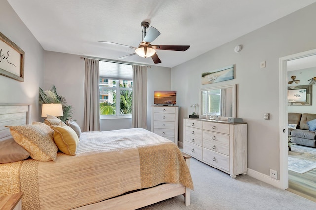 804 E Windward Way Unit 404, Lantana, FL 33462 - bedroom with light carpet, baseboards, and ceiling fan