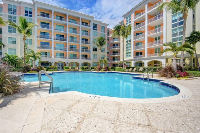 804 E Windward Way Unit 404, Lantana, FL 33462 - community pool featuring a patio
