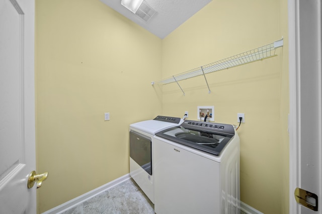 415 NW Granville St, Port Saint Lucie, FL 34986 - laundry area with separate washer and dryer and baseboards