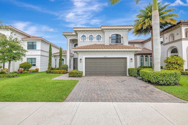 8271 Canopy Ter, Parkland, FL 33076 - mediterranean / spanish-style home with a balcony, a garage, decorative driveway, a front yard, and a tile roof