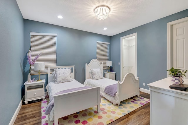 8271 Canopy Ter, Parkland, FL 33076 - bedroom with baseboards, wood finished floors, recessed lighting, and a spacious closet