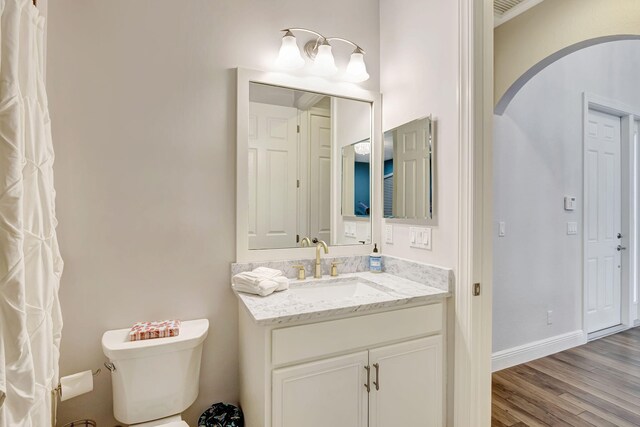 8271 Canopy Ter, Parkland, FL 33076 - bathroom with vanity, toilet, wood finished floors, and baseboards