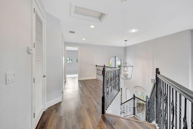 8271 Canopy Ter, Parkland, FL 33076 - hallway with an upstairs landing, a chandelier, dark wood-style flooring, recessed lighting, and baseboards