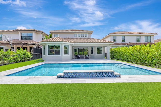 8271 Canopy Ter, Parkland, FL 33076 - rear view of property with a pool with connected hot tub, stucco siding, and a tiled roof