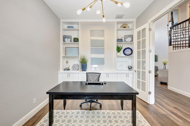 8271 Canopy Ter, Parkland, FL 33076 - office area with wood finished floors, a chandelier, baseboards, and built in shelves