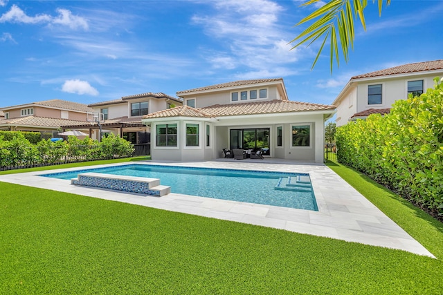 8271 Canopy Ter, Parkland, FL 33076 - rear view of house featuring stucco siding, a tile roof, a patio, and a hot tub
