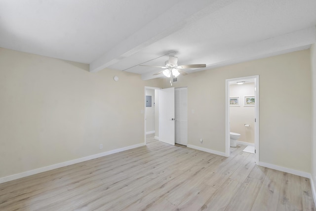 1325 S Flagler Ave Unit 104, Pompano Beach, FL 33060 - unfurnished bedroom with beam ceiling, light wood finished floors, ensuite bathroom, baseboards, and ceiling fan