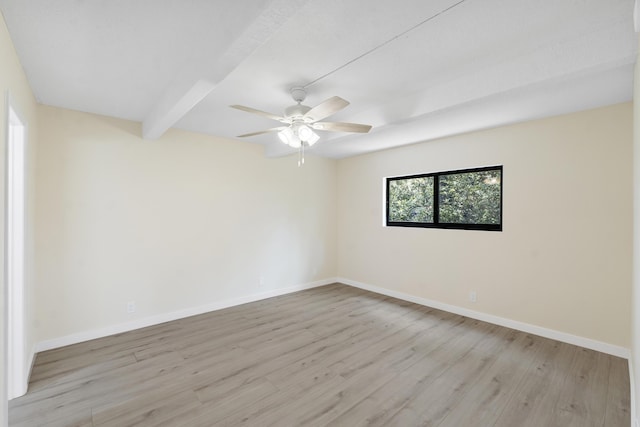 1325 S Flagler Ave Unit 104, Pompano Beach, FL 33060 - empty room with baseboards, light wood-style floors, ceiling fan, and beamed ceiling