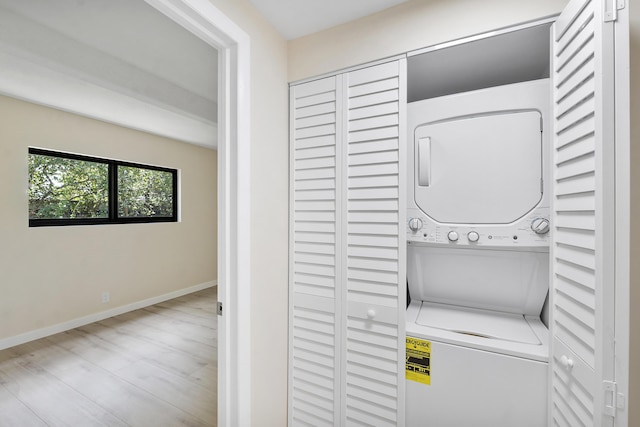 1325 S Flagler Ave Unit 104, Pompano Beach, FL 33060 - washroom featuring stacked washer / drying machine and baseboards