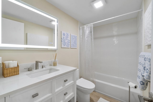 1325 S Flagler Ave Unit 104, Pompano Beach, FL 33060 - bathroom featuring vanity, toilet, shower / tub combo with curtain, and wood finished floors