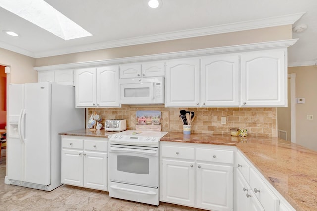 15385 Cedar Bluff Pl, Wellington, FL 33414 - kitchen featuring white appliances, a skylight, ornamental molding, tasteful backsplash, and white cabinets