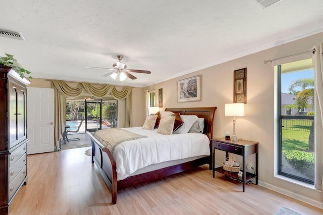15385 Cedar Bluff Pl, Wellington, FL 33414 - bedroom featuring access to exterior, light wood finished floors, crown molding, a ceiling fan, and baseboards
