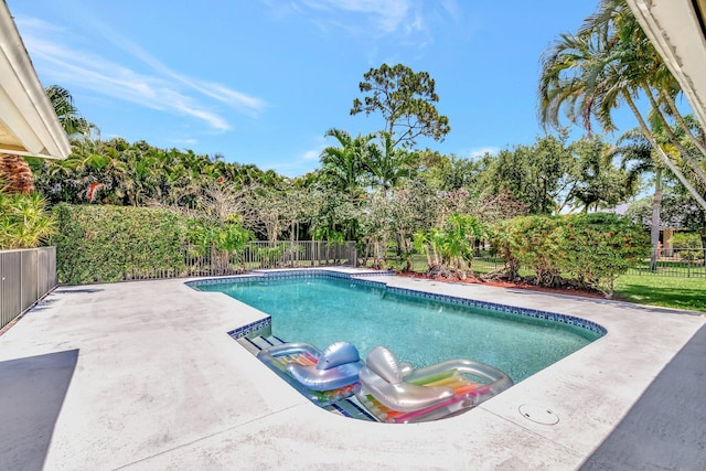15385 Cedar Bluff Pl, Wellington, FL 33414 - view of swimming pool with a fenced backyard, a patio area, and view of scattered trees