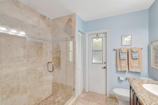 15385 Cedar Bluff Pl, Wellington, FL 33414 - full bath with toilet, a stall shower, vanity, baseboards, and tile patterned floors