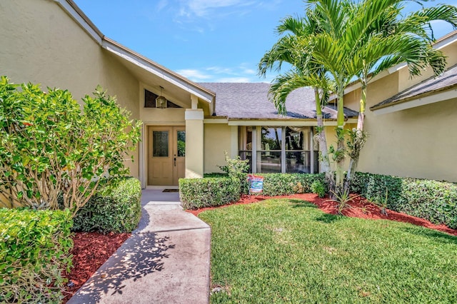 15385 Cedar Bluff Pl, Wellington, FL 33414 - entrance to property featuring a yard, stucco siding, and a shingled roof