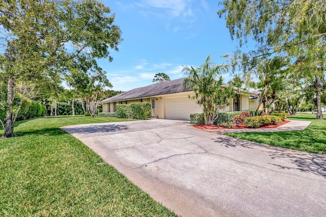 15385 Cedar Bluff Pl, Wellington, FL 33414 - view of home's exterior with an attached garage, stucco siding, a yard, and concrete driveway