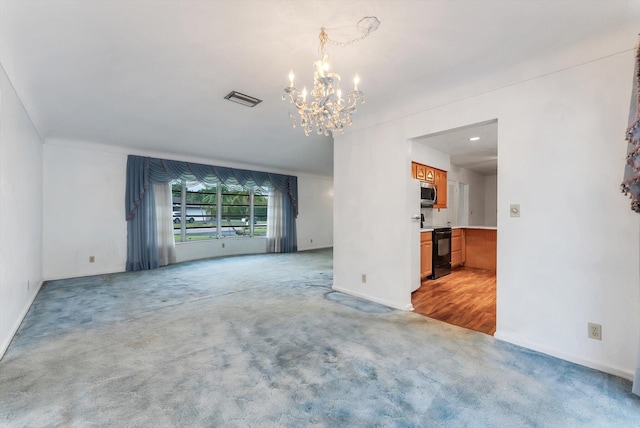 1937 Park Pl, Boca Raton, FL 33486 - unfurnished living room with a chandelier, light colored carpet, and baseboards