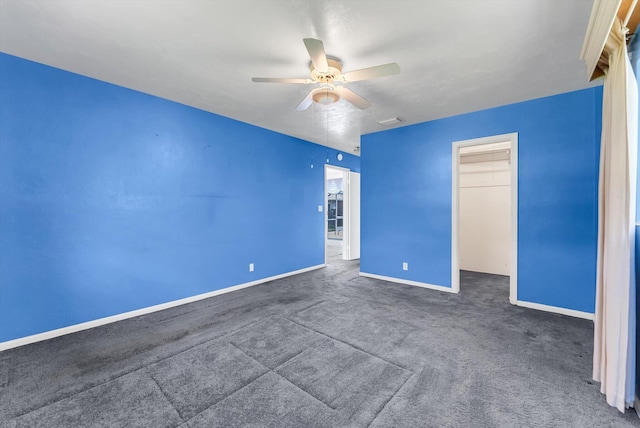 1937 Park Pl, Boca Raton, FL 33486 - unfurnished bedroom with baseboards, carpet flooring, a ceiling fan, a closet, and a spacious closet