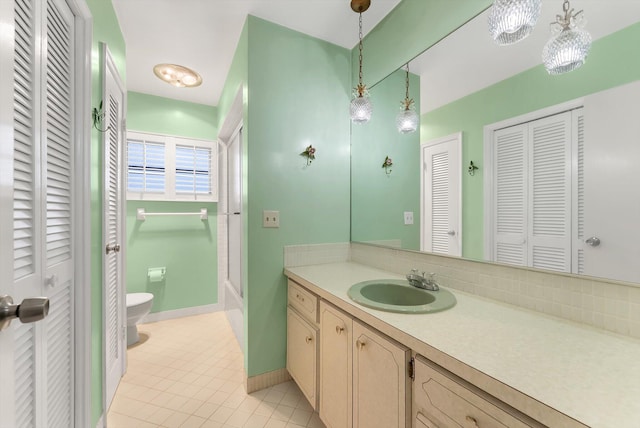 1937 Park Pl, Boca Raton, FL 33486 - full bathroom featuring a closet, toilet, vanity, tile patterned floors, and backsplash