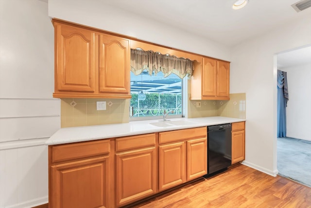1937 Park Pl, Boca Raton, FL 33486 - kitchen with black dishwasher, a sink, decorative backsplash, and light countertops