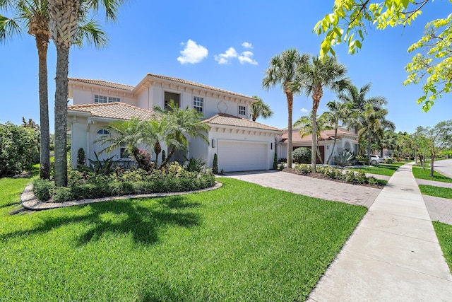 220 Carina Dr, Jupiter, FL 33478 - mediterranean / spanish home featuring stucco siding, a garage, a tiled roof, a front yard, and driveway