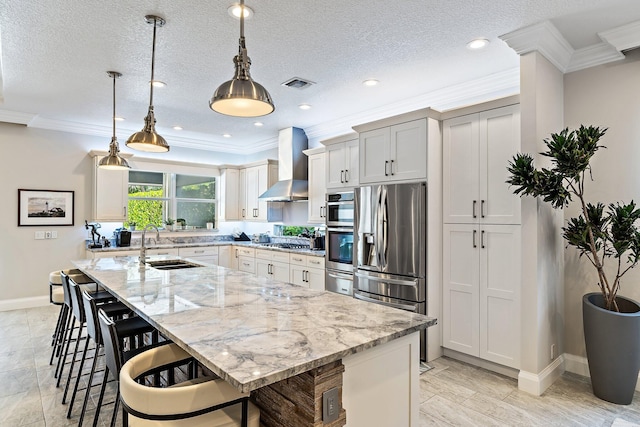 220 Carina Dr, Jupiter, FL 33478 - kitchen with wall chimney exhaust hood, appliances with stainless steel finishes, baseboards, a breakfast bar area, and a spacious island