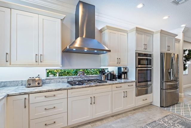 220 Carina Dr, Jupiter, FL 33478 - kitchen featuring wall chimney range hood, appliances with stainless steel finishes, a warming drawer, crown molding, and light stone counters