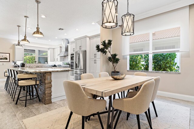 220 Carina Dr, Jupiter, FL 33478 - dining space featuring ornamental molding, baseboards, and recessed lighting